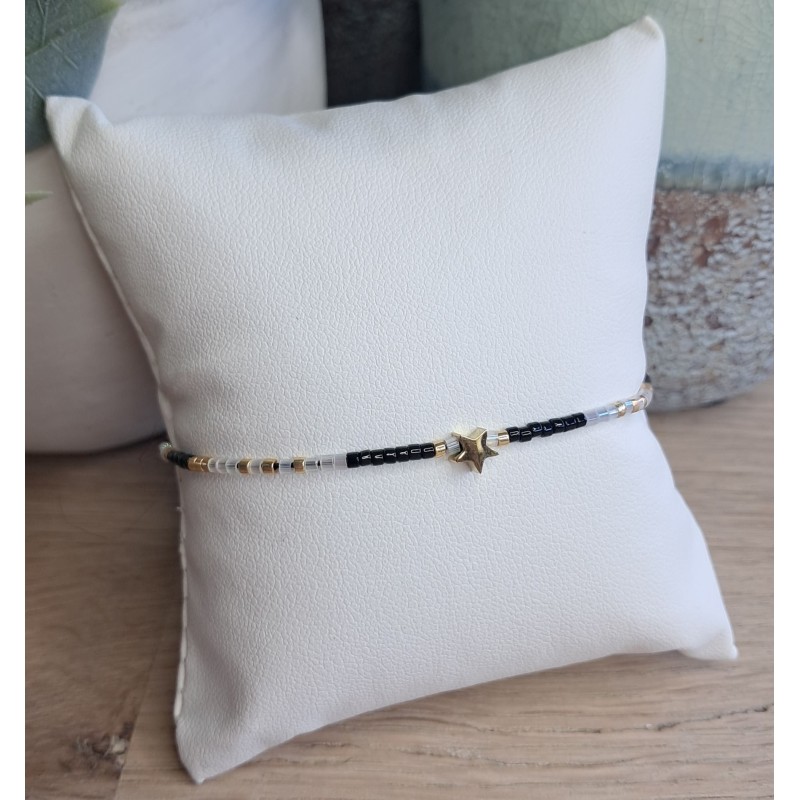 Bracelet fin blanc/noir/doré avec breloque étoile
